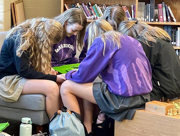 Whitesburg Students Pray over Donation Bags